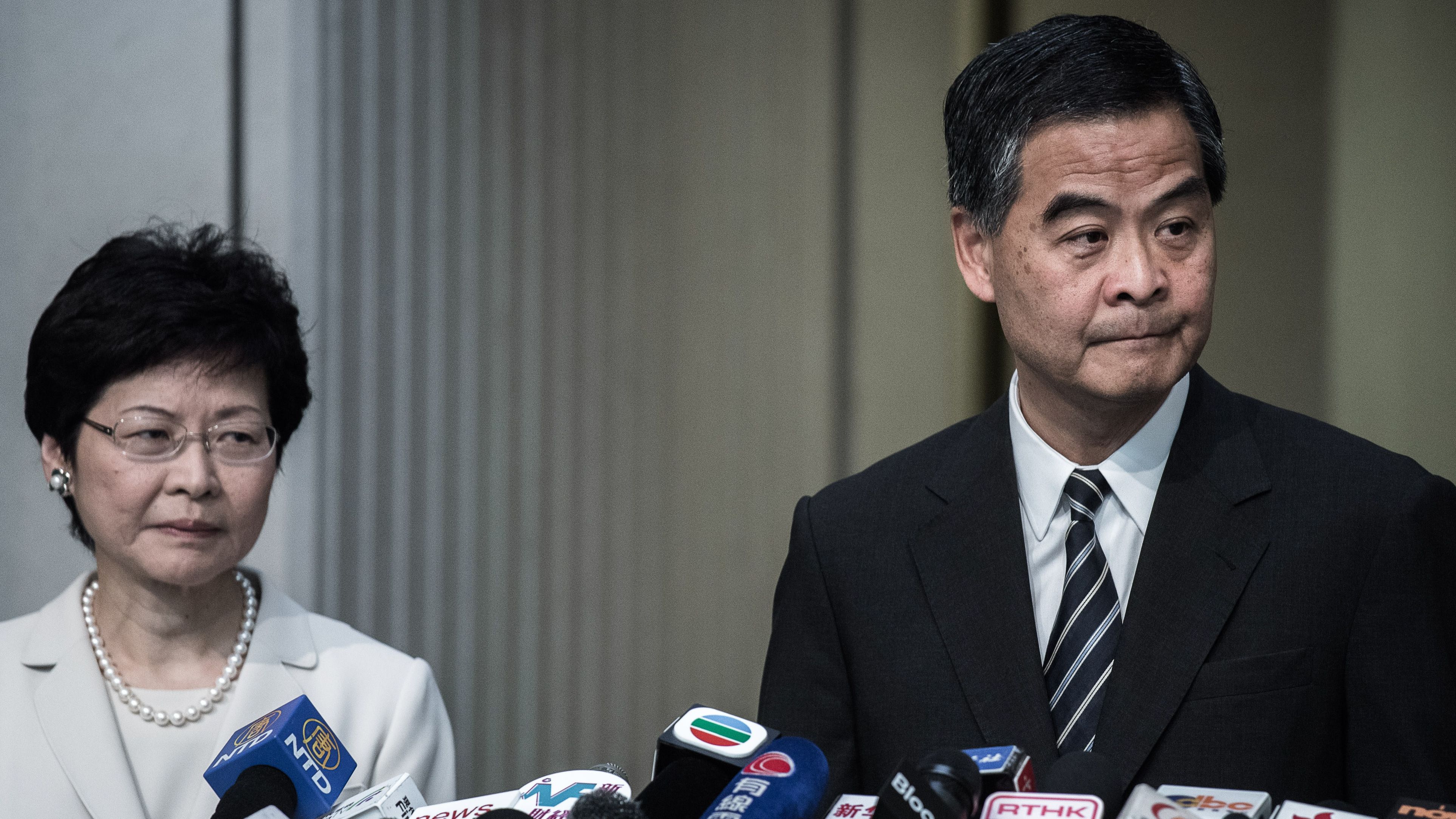 Hong Kong Chief Executive Leung Chun-ying (right) addresses a press conference next to Chief Secretary Carrie Lam (left) in Hong Kong on April 22, 2015.