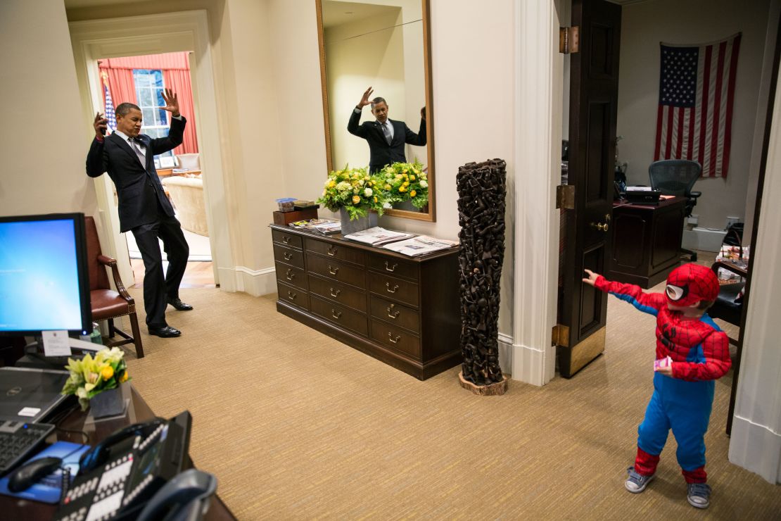 President Obama pretends to be caught in Spider-Man's web as an aide's son goes trick-or-treating.