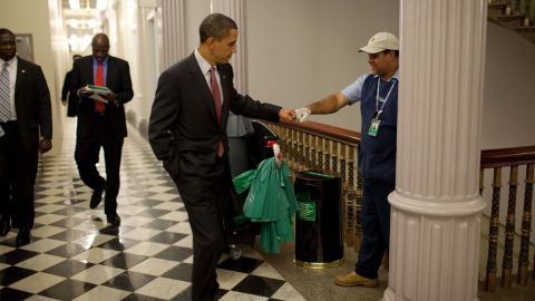 President Obama fist-bumps custodian Lawrence Lipscomb in the Eisenhower Executive Office Building.