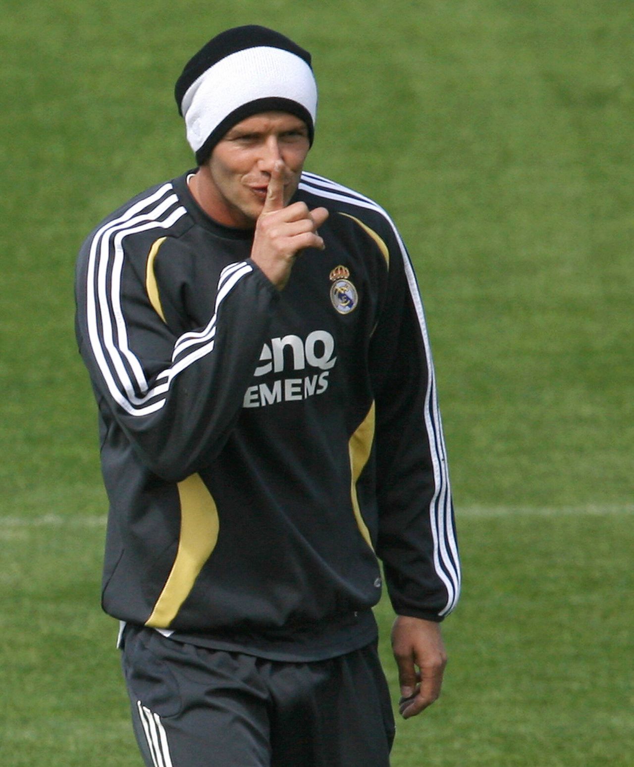 Although Beckham's life is under constant media scrutiny, sometimes he likes to tease -- here hiding his new hairstyle during a training session in Madrid.