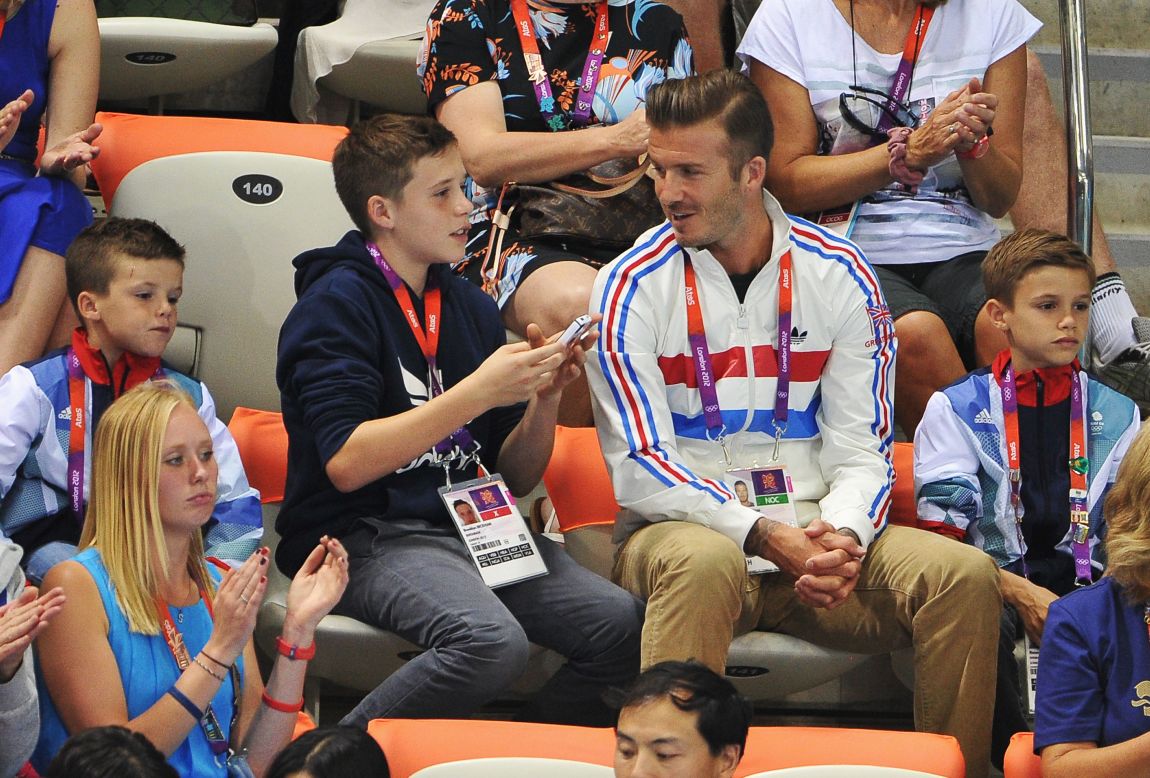 Beckham's children have grown up in the media glare surrounding him -- here he is pictured with sons (L-R) Cruz, Brooklyn and Romeo Beckham during a diving event at the 2012 London Olympics.  