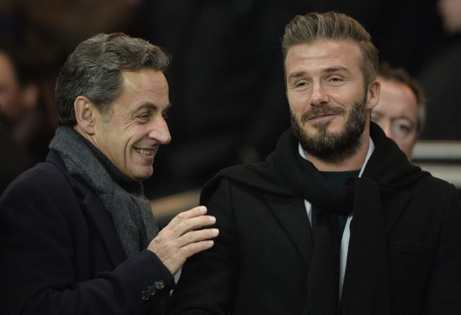 Beckham is now firmly established among the world's most powerful figures -- here he and former French president Nicolas Sarkozy watch PSG play in a Champions League match in February 2015.