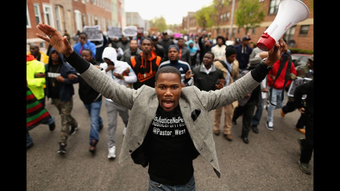 Hundreds of demonstrators march toward the Western District station on April 22.