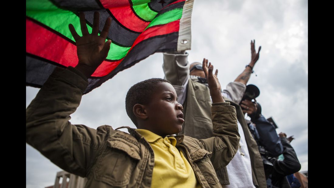 People march through the streets of Baltimore on April 22.