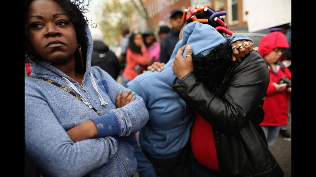 A woman is comforted during the protest on April 22.