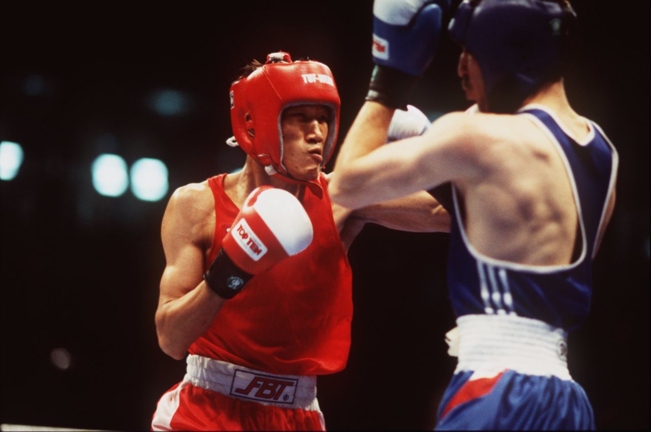Todorov (right) turned them down -- a decision he regrets to this day -- being confident he would win gold and have a successful amateur career. He beat the 19-year-old Mayweather by one point in a controversial featherweight semifinal, leaving just Thailand's Somluck Kamsing (left) as an obstacle to Olympic glory.