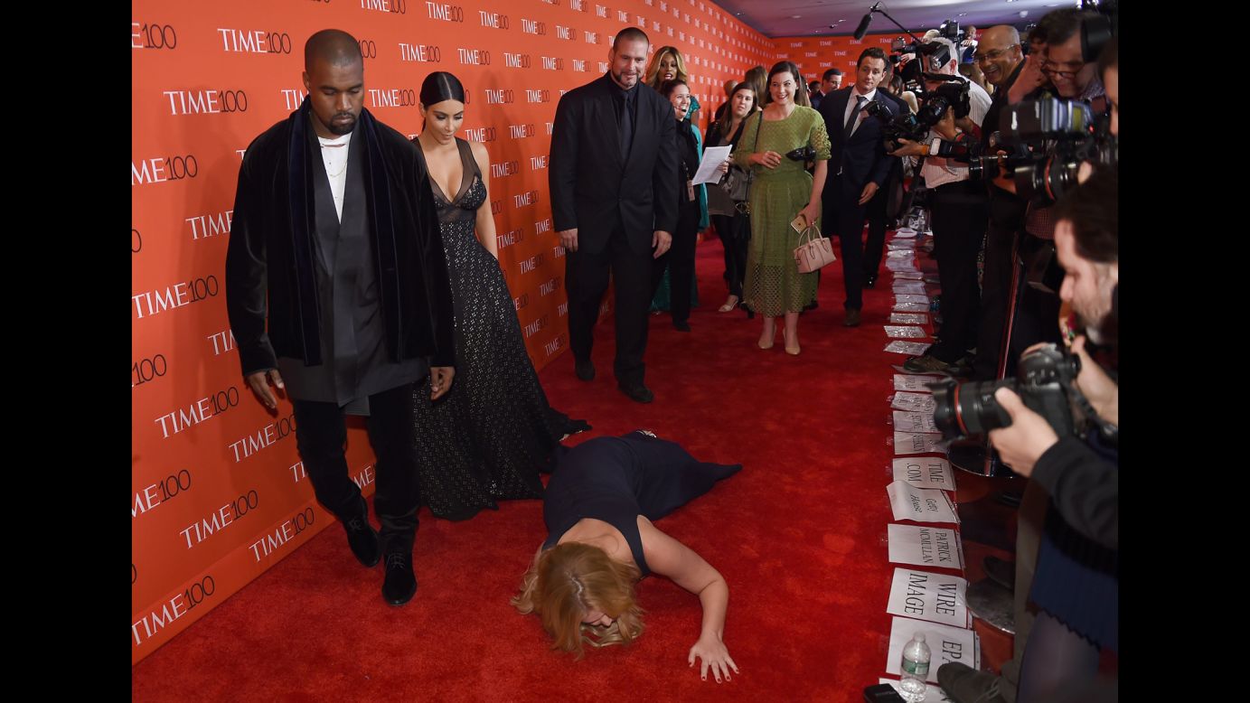Comedian Amy Schumer pretends to trip and fall on the floor in front of celebrity couple Kim Kardashian and Kanye West as they attend the Time 100 Gala in New York on Tuesday, April 21. Schumer, Kardashian and West were all on Time magazine's list of <a href="http://time.com/collection/2015-time-100/" target="_blank" target="_blank">The 100 Most Influential People</a>.