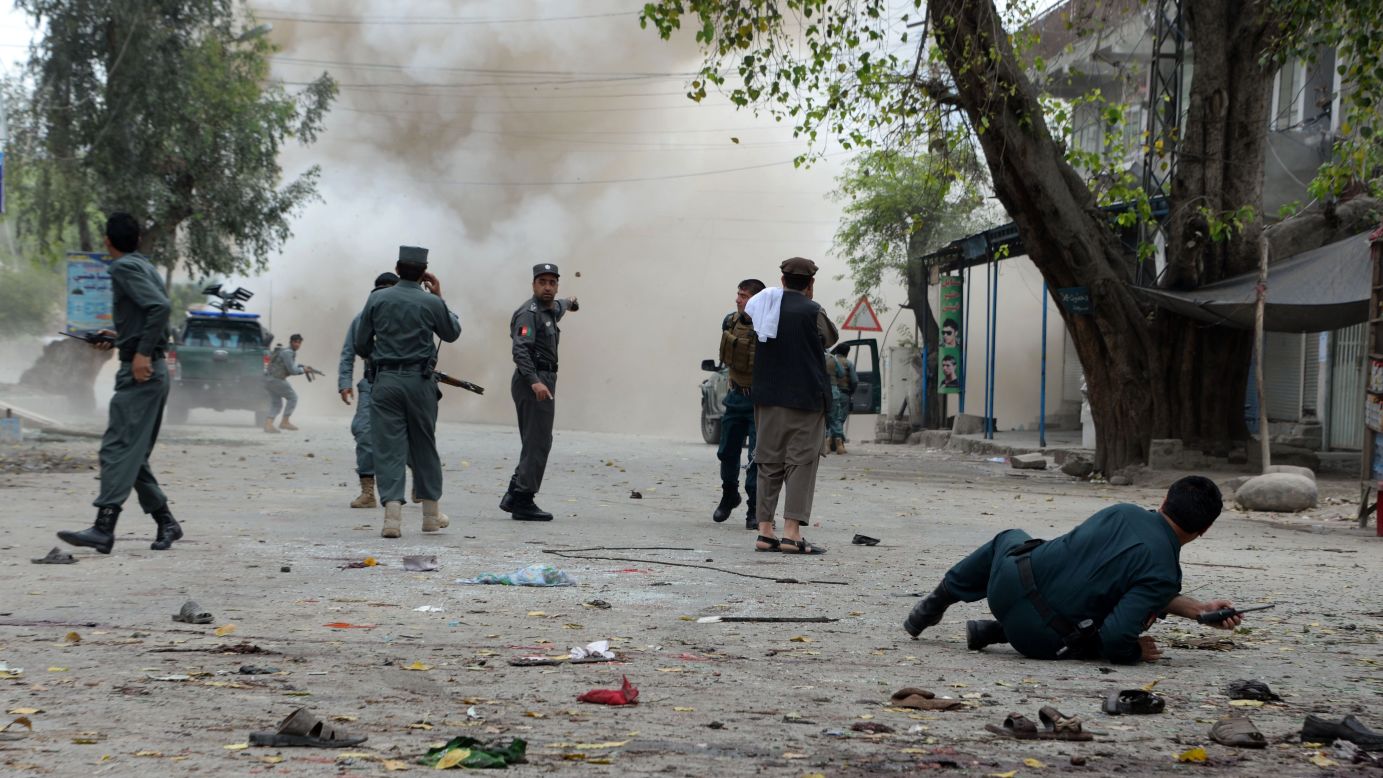 Security personnel in Jalalabad, Afghanistan, gather at the scene of an explosion on Saturday, April 18. A suicide bomber on a motorbike <a href="http://www.cnn.com/2015/04/18/asia/afghanistan-violence/index.html" target="_blank">blew himself up in front of a bank,</a> a local government spokesman said. The ISIS terrorist group claimed responsibility for the attack, which killed at least 33 people and injured more than 100 others, public health spokesman Najibullah Kamawal said. The claim appears to be the first in Afghanistan by ISIS, CNN's Nick Paton Walsh said.
