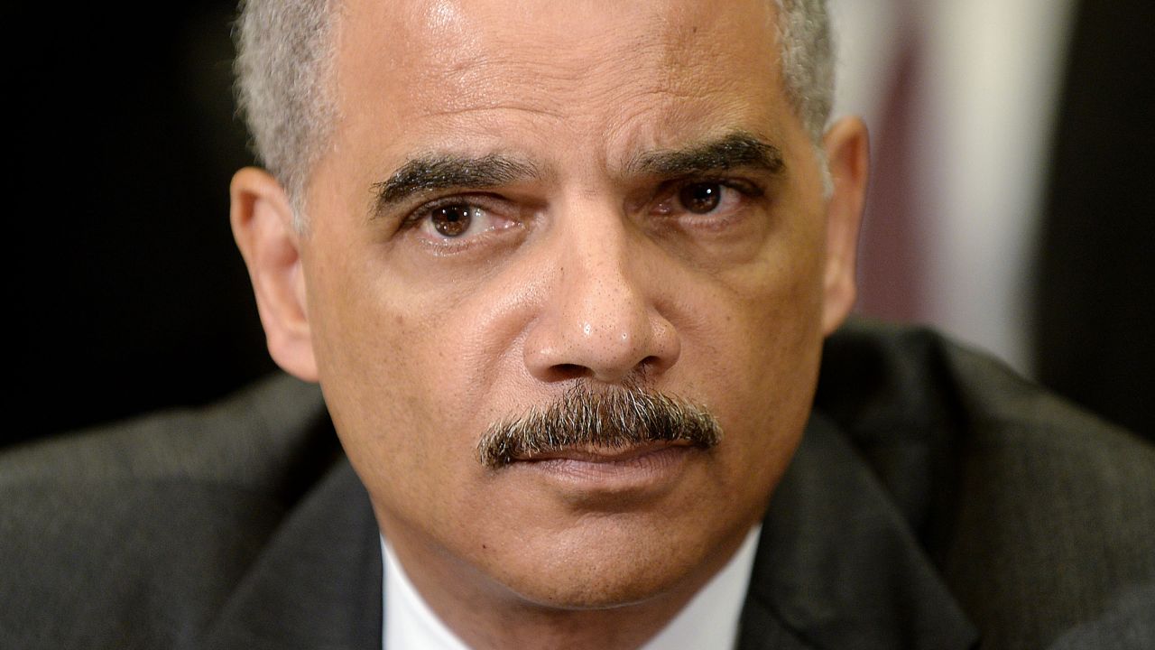 U.S. Attorney General Eric Holder attends a meeting with the My Brother's Keeper Task Force to receive a 90-day report on its progress in the Roosevelt Room of the White House in May 2014. Holder's resignation was announced in September 2014, but his replacement, Loretta Lynch, was not confirmed by the Senate until April 23, 2015.