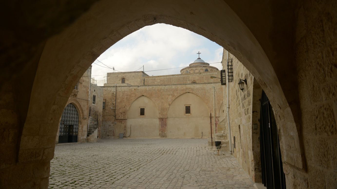 The St. James Cathedral is seen through arches in the Armenian Quarter.