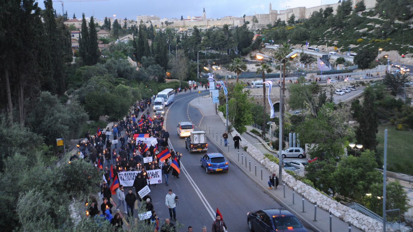 Armenian community members walk through the streets during a candlelit vigil in Jerusalem on April 23.