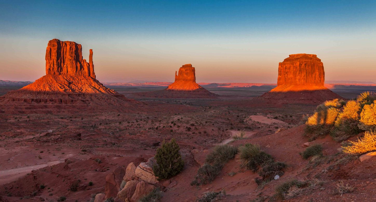 Monument Valley Navajo Tribal Park straddles the Utah/Arizona border and is one of only a few tribal parks in the region. Just inside the park gates you'll get to the visitor center and hotel with this classic view of the famous Mittens Buttes.