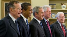 U.S. President George W. Bush, center, stands with President-elect Barack Obama, second left, former President George H.W. Bush third left, former President Bill Clinton, second right and former President Jimmy Carter, right, in the Oval Office of the White House in Washington, D.C., on January 7, 2009. 