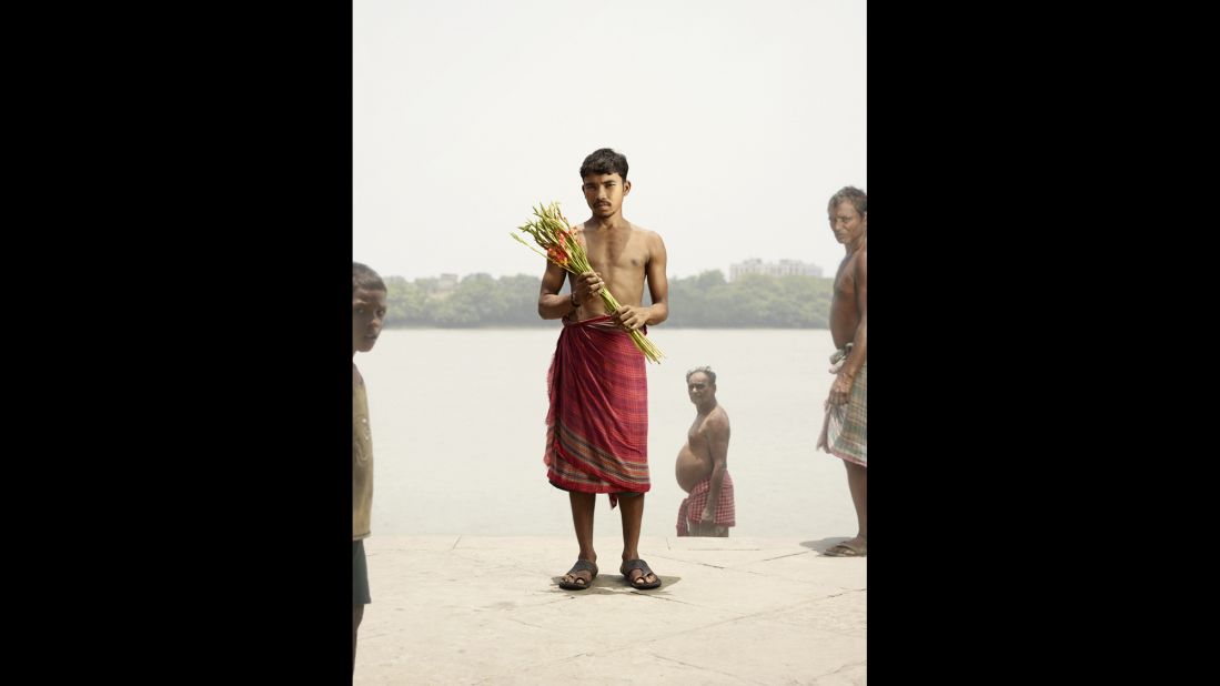 Sanjit Malik poses with a bouquet of gettylade flowers.