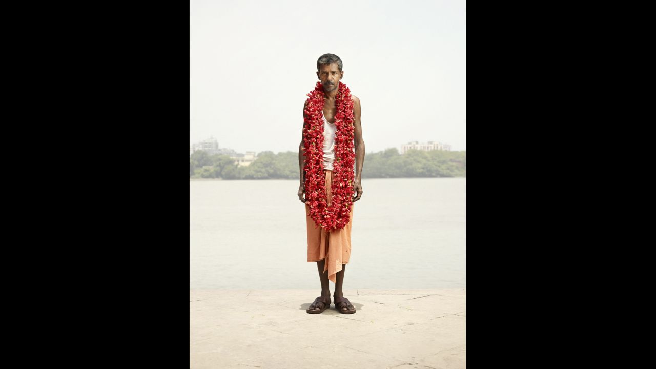 Hermann's photos have a surreal effect and overexposed look that make his subjects stand out. In this portrait, S.K. Bhagat pops with color as he wears a necklace of java flowers for sale around his neck.