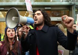 Russell Brand, seen here campaigning against social housing evictions in London last year, has rejected voting altogether.