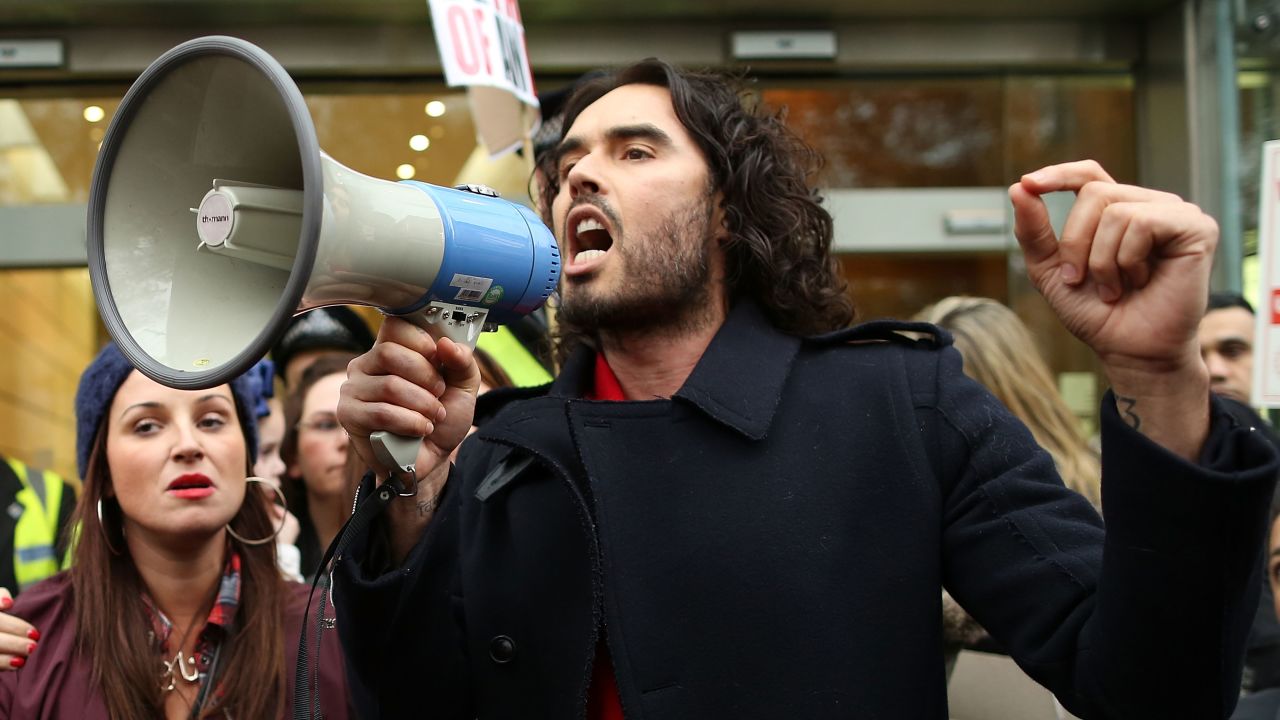 Russell Brand, seen here campaigning against social housing evictions in London last year, has rejected voting altogether.