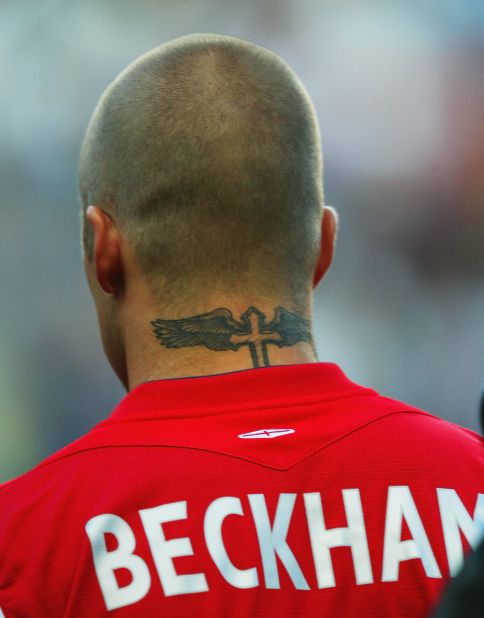 This Gothic winged cross on his neck, unveiled ahead of the 2004 European Championships, is just above the name of his first son Brooklyn. 