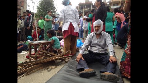 Injured people receive treatment in Kathmandu. A CNN reporter said medics were focused on treating the most severely injured.