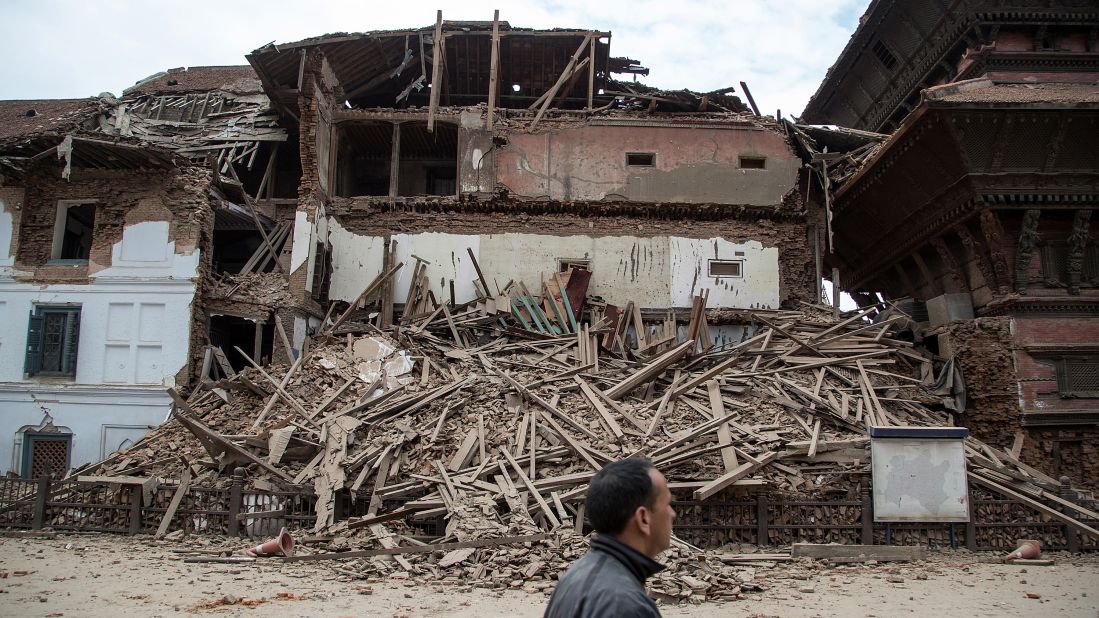 A man walks past a collapsed temple at Basantapur Durbar Square.