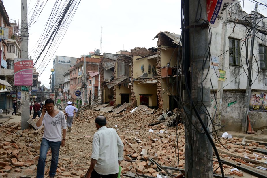 The rubble of collapsed walls fills a street in Lalitpur, on the outskirts of Kathmandu, on April 25.