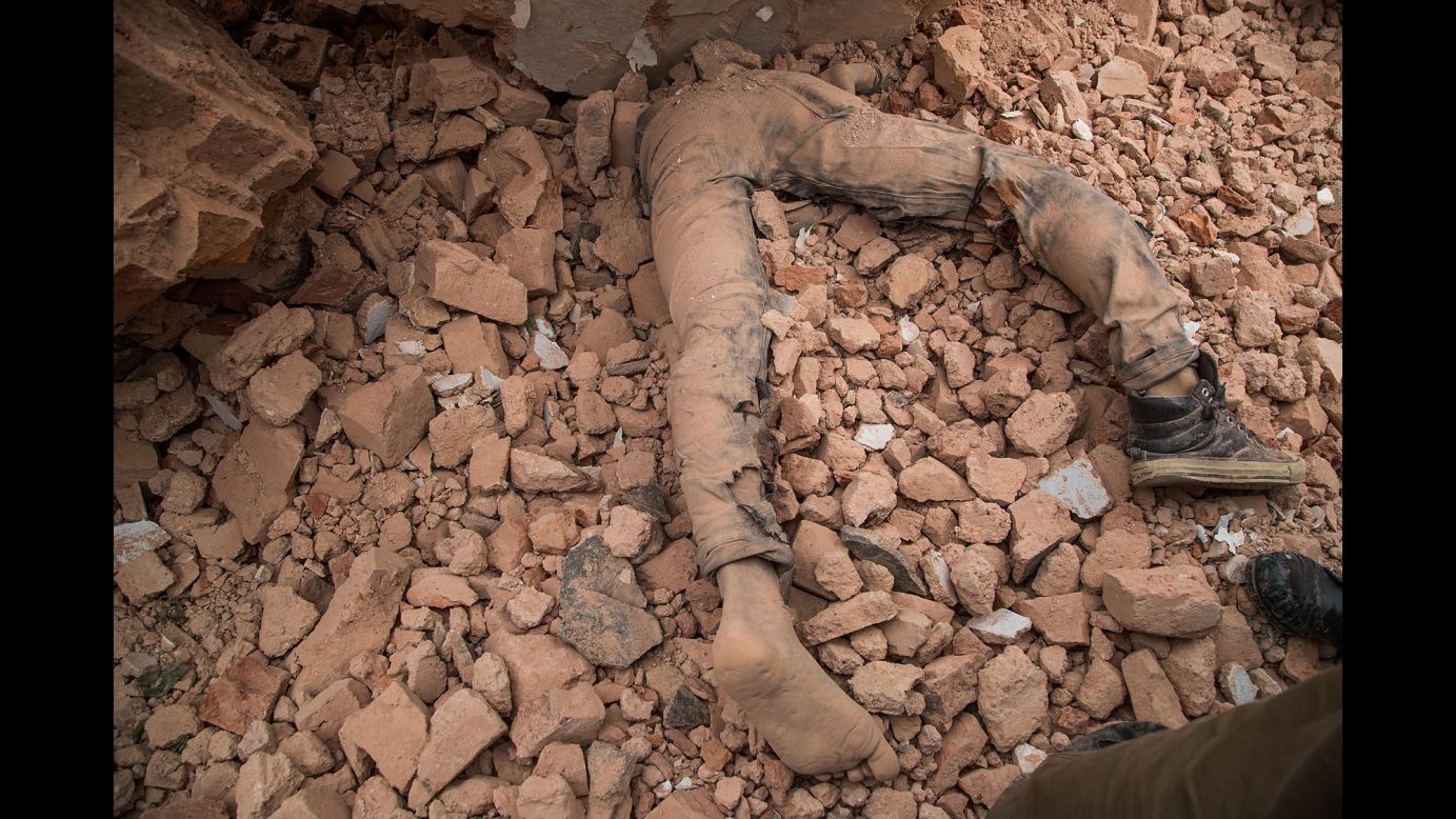 A victim of Nepal's earthquake lies in the debris of Dharahara after it collapsed on April 25 in Kathmandu, Nepal. 