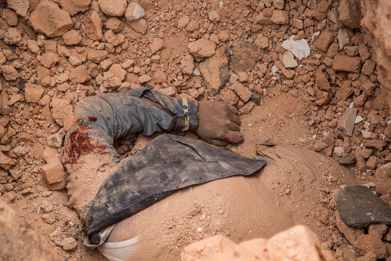 A victim's body is seen in the debris of the collapsed Dharahara on April 25. 
