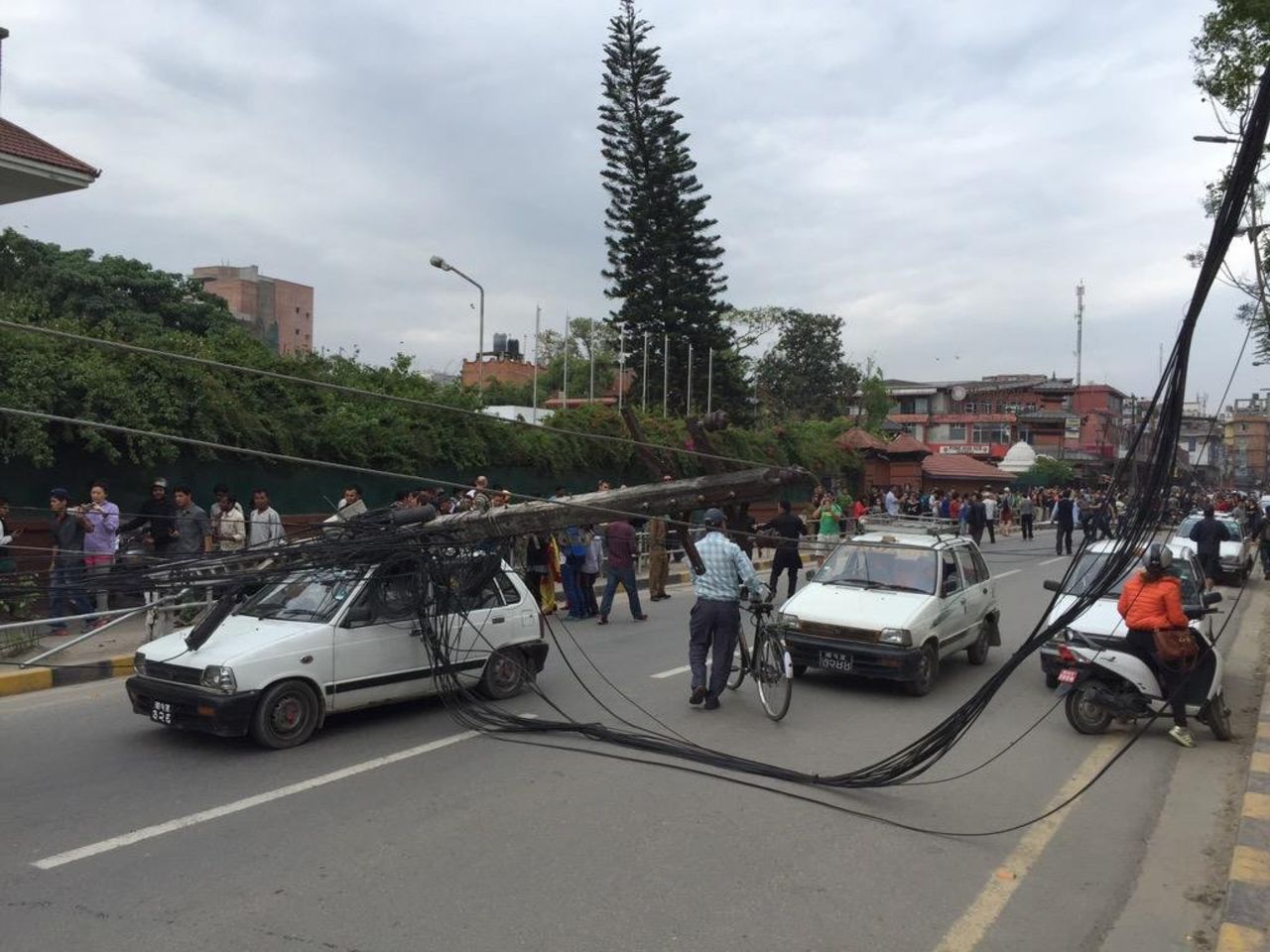 Jonathan Khoo's photo shows downed power lines and people gathering in the street. 