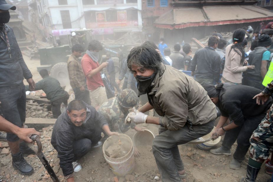 Rescuers clear rubble in Kathmandu's Basantapur Durbar Square on  April 25.