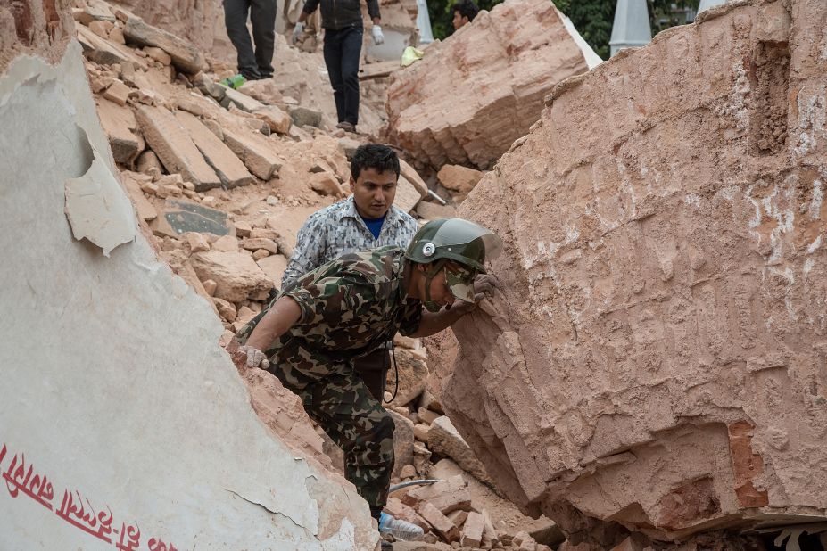 Emergency rescue workers search for survivors in the debris of Dharahara on April 25.