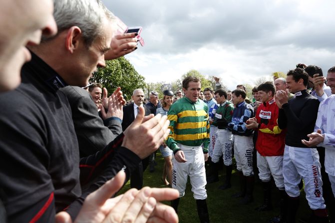 McCoy, who won 4,382 races <a target="_blank">and broke just about every bone in his body</a>, was cheered into the parade ring by his fellow jockeys.