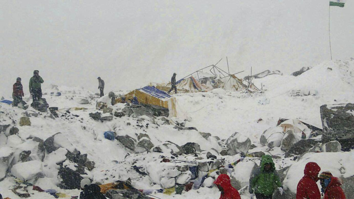 People sort through wreckage near Everest base camp on April 25.