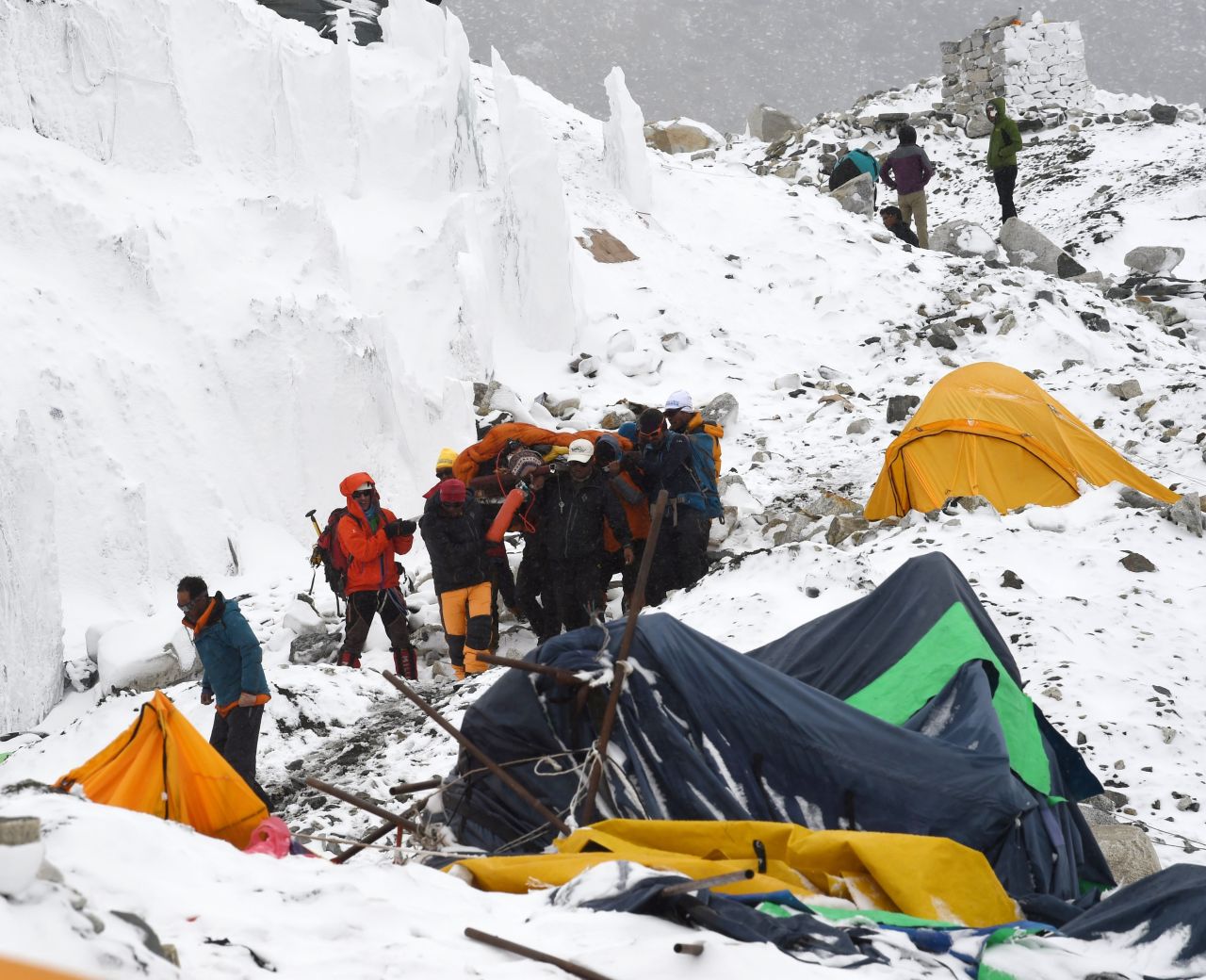 Rescuers carry a Sherpa injured by the avalanche on April 25. 