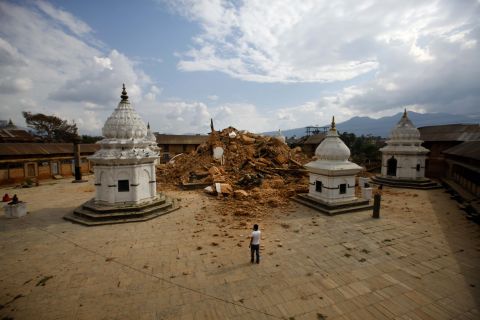 People look at the debris of one of the oldest temples in Kathmandu on April 26.