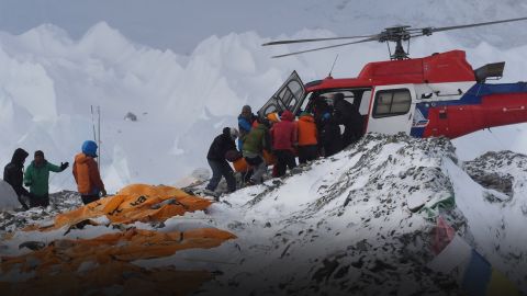 An injured person is loaded onto a rescue helicopter at Everest Base Camp on April 26, 2015, a day after an avalanche triggered by an earthquake devastated the camp. Rescuers in Nepal are searching frantically for survivors of a huge quake on April 25, that killed nearly 2,000, digging through rubble in the devastated capital Kathmandu and airlifting victims of an avalanche at Everest base Camp. The bodies of those who perished lie under orange tents. AFP PHOTO/ROBERTO SCHMIDT (Photo credit should read ROBERTO SCHMIDT/AFP/Getty Images)