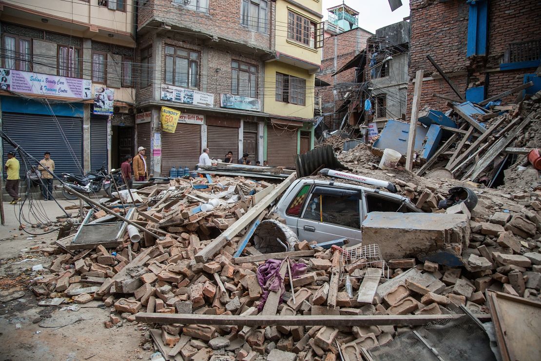 A taxi lies buried in rubble in Thamel, Kathmandu.
