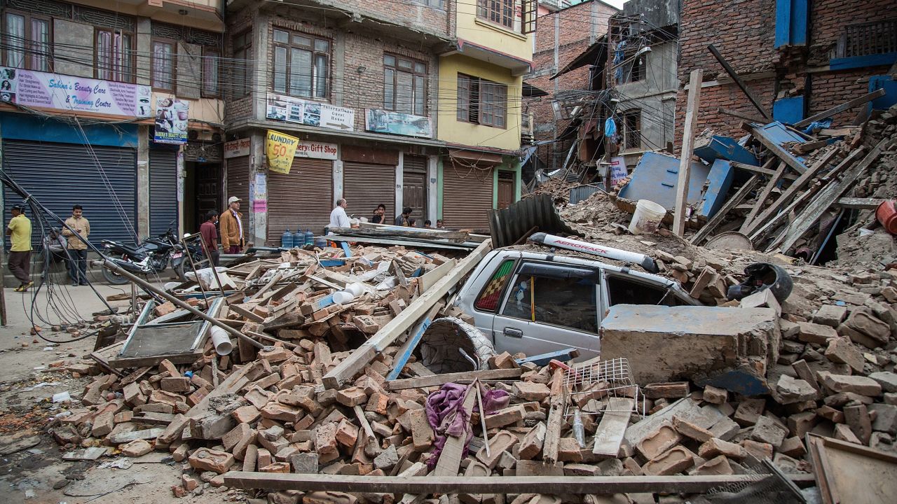 A taxi lies buried in rubble in Thamel, Kathmandu.