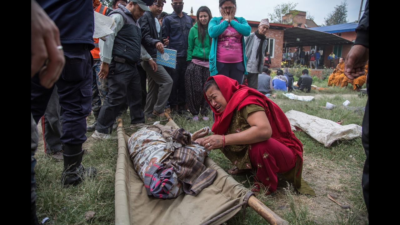 A woman cries after identifying the body of a relative in Bhaktapur on April 26.