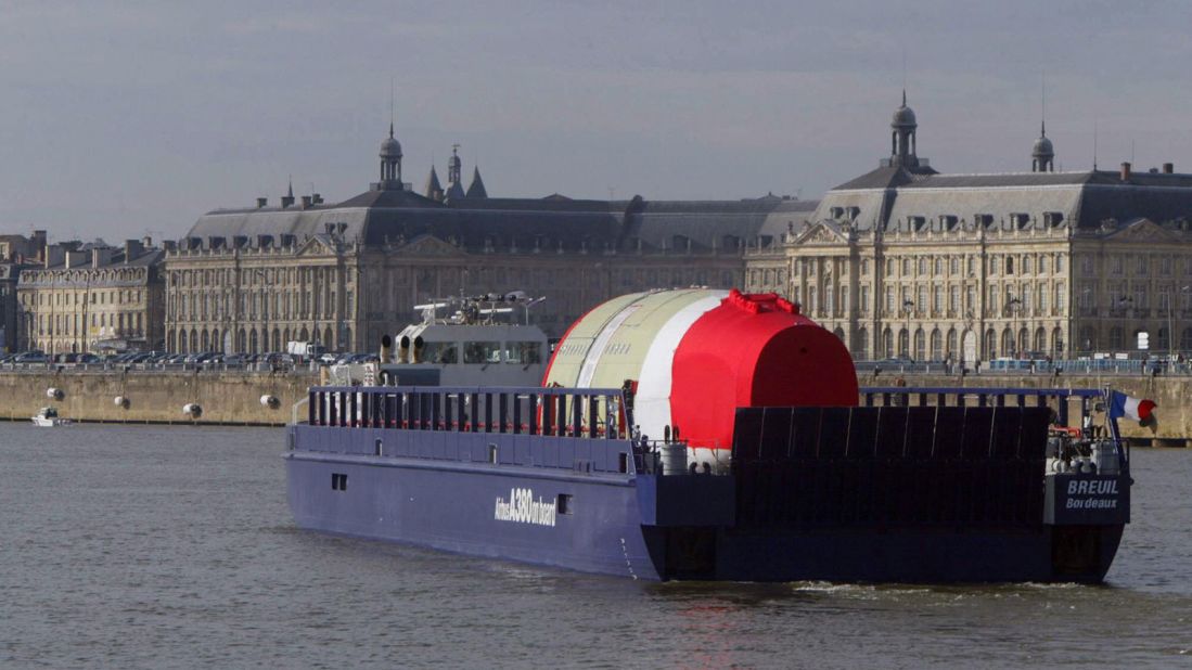 Different sections of the A380 are built in different locations across Europe then brought for assembly in Toulouse, France. Here the rear section of the fuselage of the first A380 makes its way by barge through the French city of Bordeaux. 