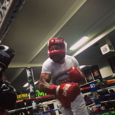 Theophane lands a right hook as part of his training session. The 34-year-old spars six consecutive lung-busting six-minute rounds. His opponent is replaced with a fresh fighter around three rounds, so his workout stays at a high level of intensity.  