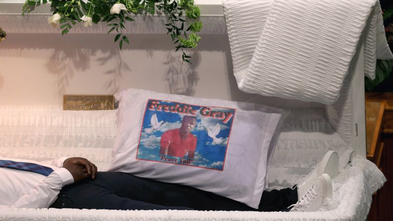 A pillow with Freddie Gray's image sits inside his casket during <a href="index.php?page=&url=http%3A%2F%2Fwww.cnn.com%2F2015%2F04%2F27%2Fus%2Fbaltimore-freddie-gray-funeral%2Findex.html">his funeral at the New Shiloh Baptist Church in Baltimore</a> on Monday, April 27. Gray, 25, was arrested on April 12. According to his attorney, Gray died a week later from a severe spinal cord injury he received while in police custody.