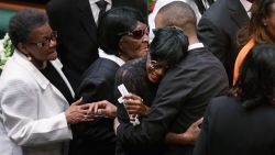 Freddie Gray's twin sister, Fredericka Gray, is embraced by family members and supporters during her brother's funeral.