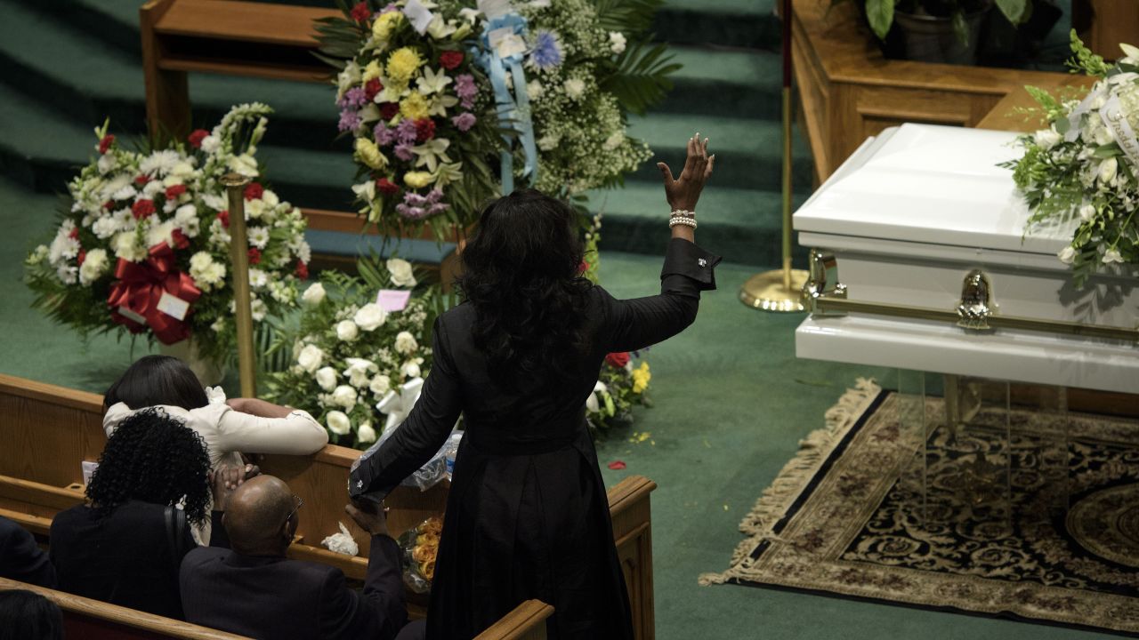 Gray's loved ones pray during his funeral.
