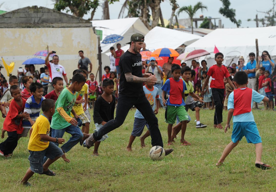 Among his charity projects, Beckham is a UNICEF ambasador. Here he plays with Filipino children who survived Typhoon Haiyan, which killed over 6,000 people in late 2013 and devastated large areas of Southeast Asia. 