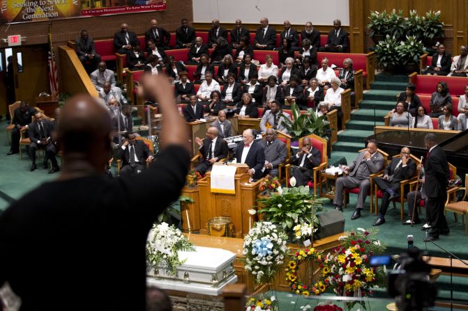 People in the audience react as attorney William Murphy speaks at Gray's funeral.