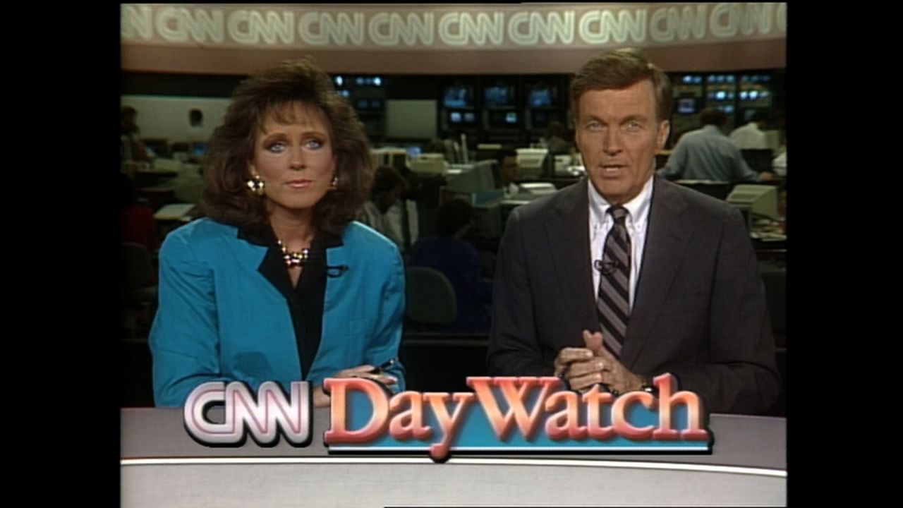 Mary Anne Loughlin and Ralph Wenge anchor "CNN Day Watch" in 1990.