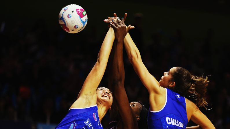 Sulu Tone-Fitzpatrick and Kayla Cullen of the Mystics defend against Romelda Aiken of the Firebirds during a match on Sunday, April 26, in Auckland, New Zealand.