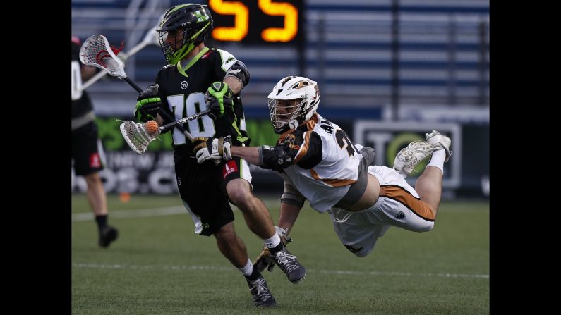 John Ranagan of the Rochester Rattlers chases Steve DeNapoli of New York Lizards in the second half of a lacrosse match on Sunday, April 26, in Hempstead, New York.