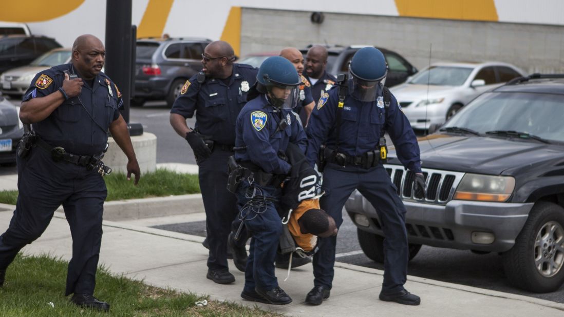 Police handle the protesters during a riot on April 27.