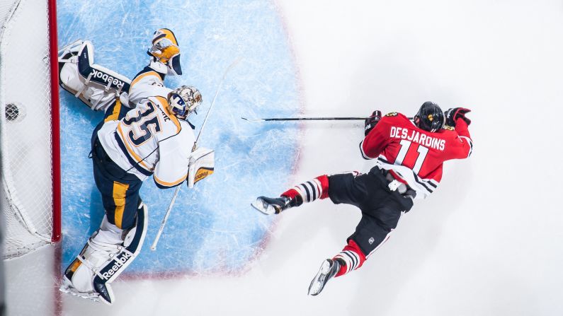 Nashville Predators goalie Pekka Rinne makes a save against a goal attempt by Andrew Desjardins of the Chicago Blackhawks during the 2015 NHL Stanley Cup Playoffs on Tuesday, April 21, in Chicago.